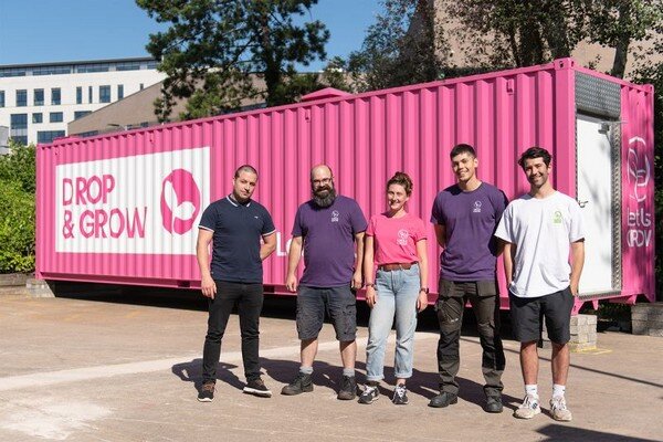 The LettUs Grow team hand over the DROP &amp; GROW to The Greener Greens Co.; image sourced from LettUs Grow