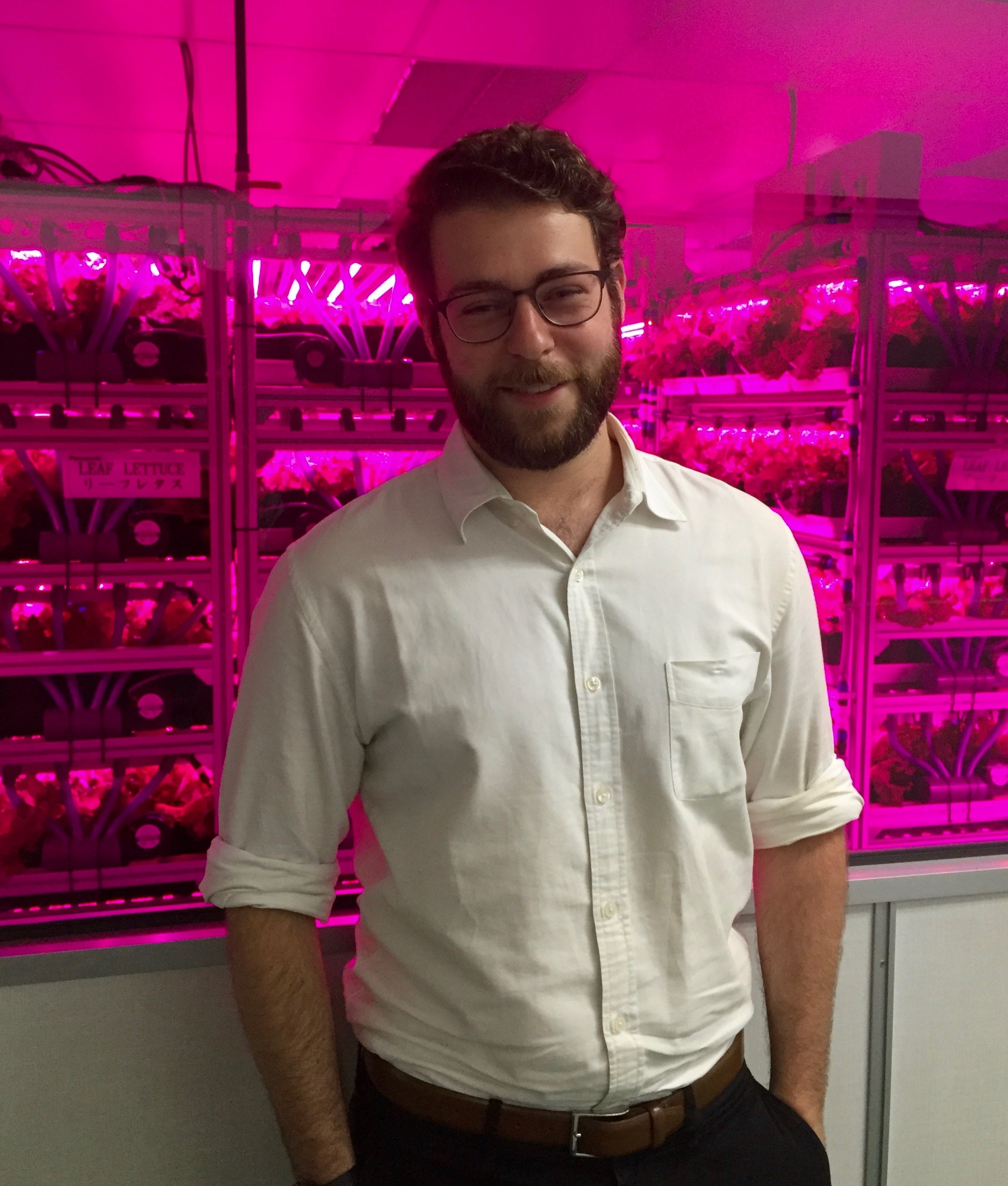 Jacob Eisenberg visiting the Veggie Life Plant Factory headquarters in Singapore during his journey throughout Asia. This article is Part 1 of a series that will bring Jacob's adventures to Agritecture readers across the globe. (Credit: Jacob Eisenb…