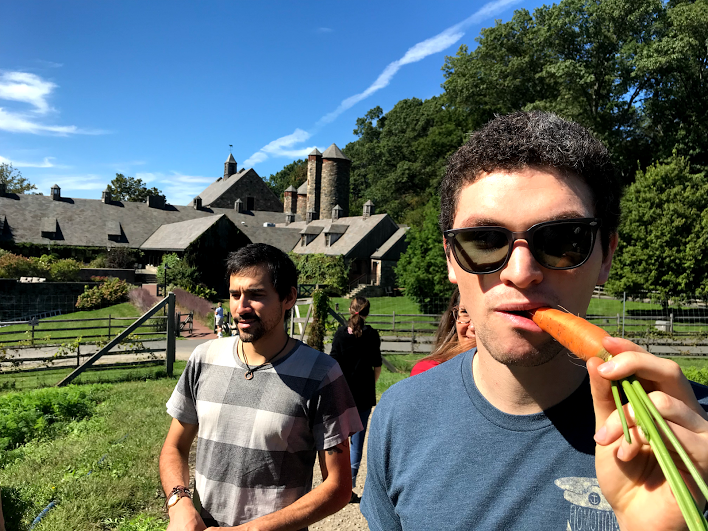 Jeff and Orion sampling carrots grown on the farm during our Insider's tour