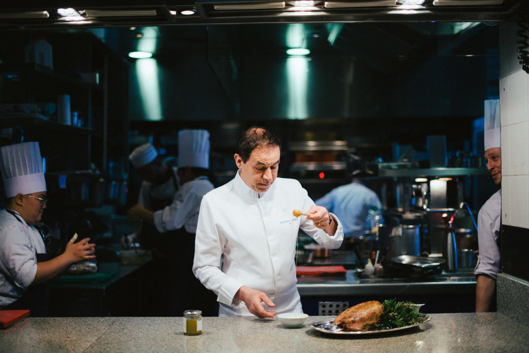  Philippe Labbé, the chef of La Tour d’Argent restaurant, preparing a duck dish using honey made on the roof.   