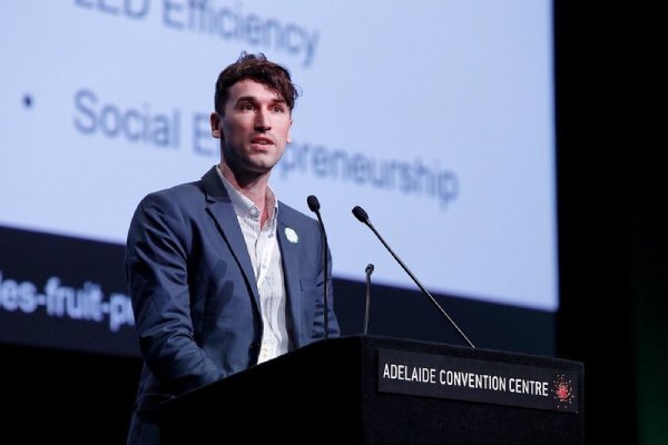 Henry Gordon-Smith speaking at a conference